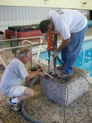 People Repairing Diving Board Base - Diving Board Repair